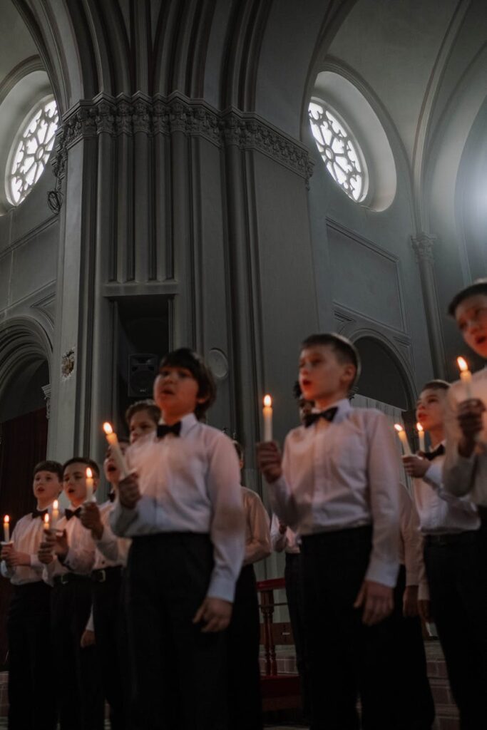 group of children holding candle lights