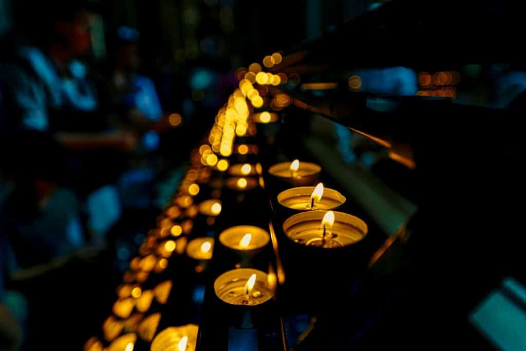 lighted candles in close up photography